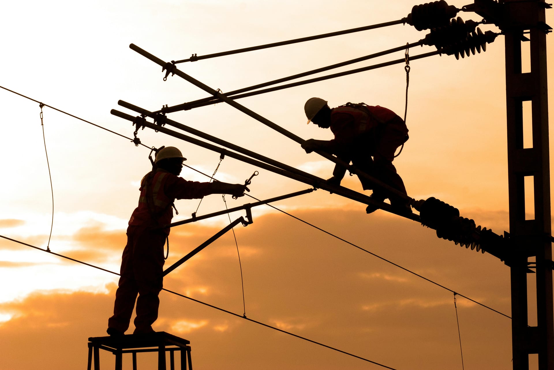 Licensed electrician running electrical wiring and conduit in residential construction